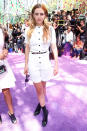 <p>Riley Keough made her chic white romper a little more rocker by pairing it with black boots.</p>