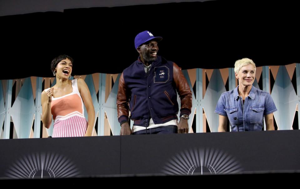 ANAHEIM, CALIFORNIA - MAY 28: (L-R) Rosario Dawson, Rick Famuyiwa and Katee Sackhoff attend the panel for “The Mandalorian” series at Star Wars Celebration in Anaheim, California on May 28, 2022. (Photo by Jesse Grant/Getty Images for Disney)