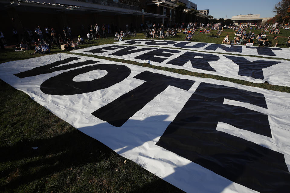 FILE - In this Nov. 7, 2020, file photo, a banner that says "Count Every Vote," covers the ground in Philadelphia, after Democrat Joe Biden defeated President Donald Trump. Trump and his allies have fomented the idea of a “rigged election” for months, promoting falsehoods through various media and even lawsuits about fraudulent votes and dead voters casting ballots. While the details of these spurious allegations may fade over time, the scar it leaves on American democracy could take years to heal. (AP Photo/Rebecca Blackwell, File)