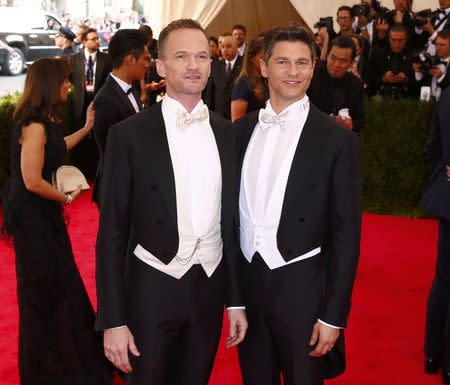 Neil Patrick Harris and his husband David Burtka arrives at the Metropolitan Museum of Art Costume Institute Gala 2015 celebrating the opening of "China: Through the Looking Glass" in Manhattan, New York May 4, 2015. REUTERS/Lucas Jackson