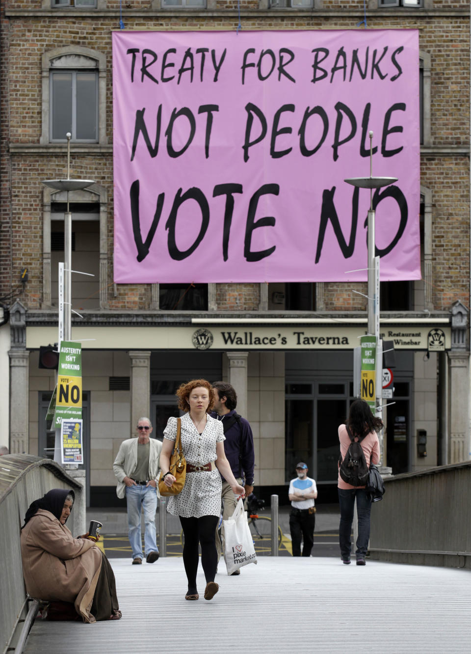 A poster hangs from a building calling for people to vote NO in the upcoming European Fiscal Treaty in central Dublin, Ireland, Tuesday, May 29, 2012. Ireland goes to the polls on May 31 in a national referendum to vote on the adoption of the European Union's Fiscal Treaty which aims to govern the national budgets of the member countries.(AP Photo/Peter Morrison)