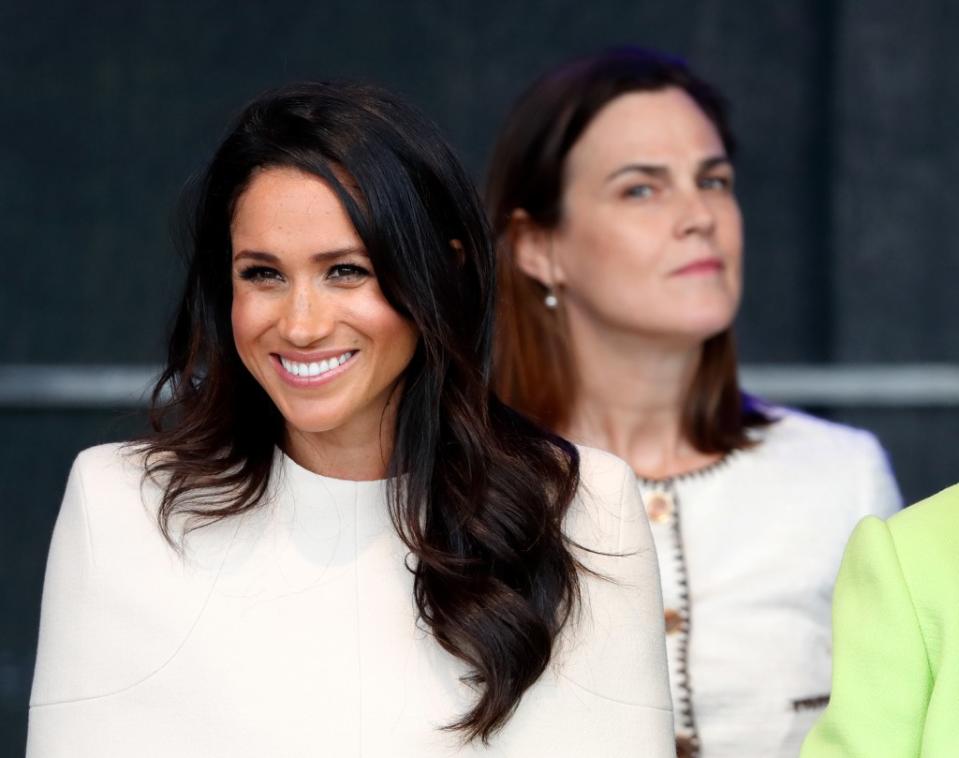 Meghan Markle (left) and former palace aide Samantha Cohen. Getty Images