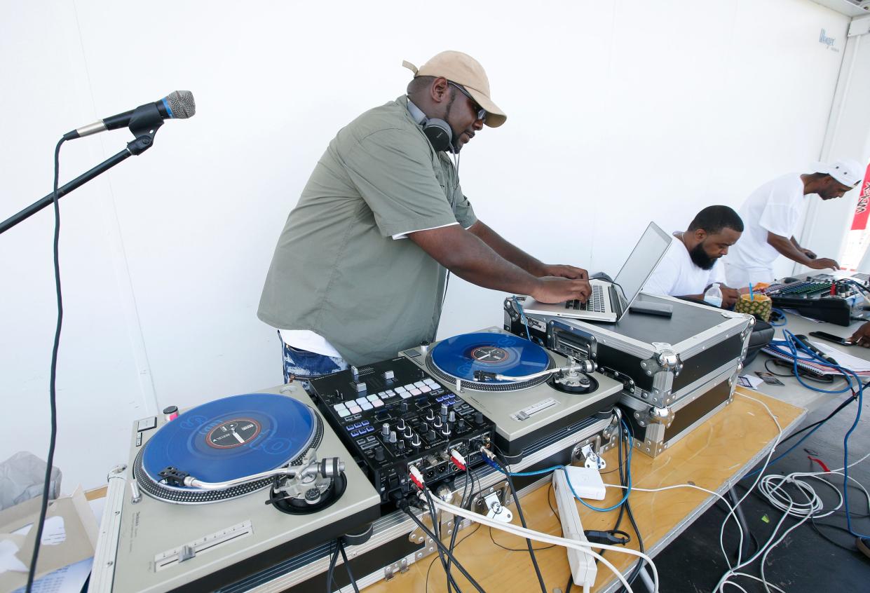 "DJ Shawn Touch" (Marchon Postell of Greece) mixes tunes during the Summer Soul Music Festival at Frontier Field.