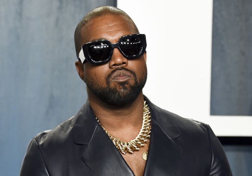 Kanye West poses for photos on a red carpet