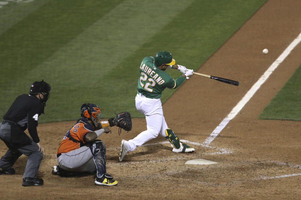 Oakland Athletics's Ramón Laureano drives in the winning run with a single against the Houston Astros during the ninth inning of a baseball game in Oakland, Calif., Wednesday, Sept. 9, 2020. (AP Photo/Jed Jacobsohn)