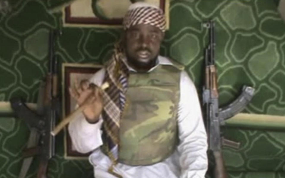 FILE - This file image made available Wednesday, Jan. 10, 2012, taken from video posted by Boko Haram sympathizers, shows the leader of the radical Islamist sect Imam Abubakar Shekau. Boko Haram has claimed responsibility for the April 15, 2014, mass abduction of nearly 300 teenage schoolgirls in northeast Nigeria. Even before the kidnapping, the U.S. government was offering up to a $7 million reward for information leading to the arrest of Shekau, whom the U.S. has labeled a specially designated global terrorist. (AP Photo/File)