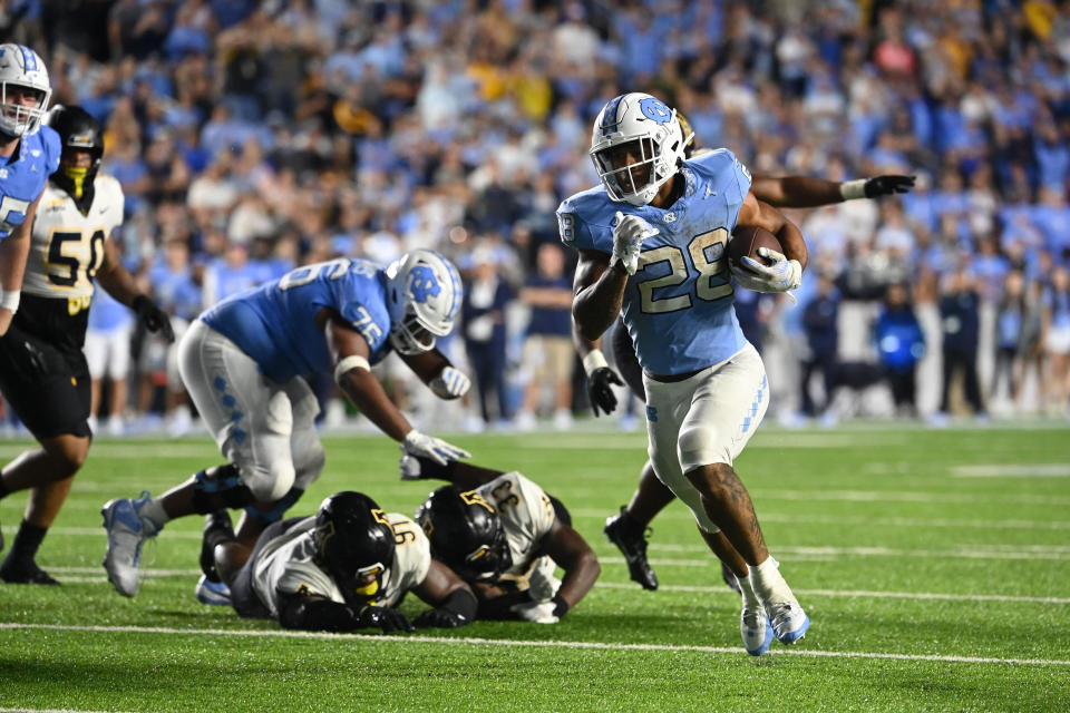 Sep 9, 2023; Chapel Hill, North Carolina, USA; North Carolina Tar Heels running back Omarion Hampton (28) runs for a touchdown in the first overtime at Kenan Memorial Stadium. Mandatory Credit: Bob Donnan-USA TODAY Sports