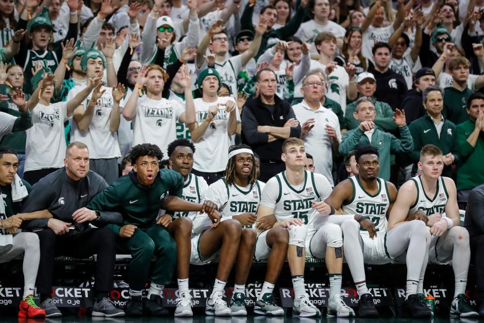 Michigan State bench plays and student section watch guard Tre Holloman (not in the photo) attempt free throw against Northwestern during the second half at Breslin Center in East Lansing on Wednesday, March 6, 2024.