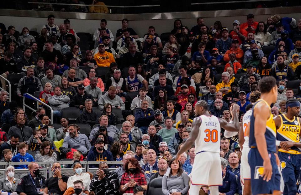 Indiana Pacers and New York Knicks fans sit in the stands watching the game Wednesday, Nov. 3, 2021 at Gainbridge Fieldhouse, in Indianapolis. Indiana Pacers lead at the half against the New York Knicks, 59-50. 