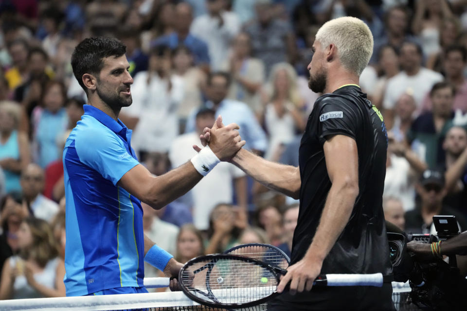 Novak Djokovic, of Serbia, shakes hands with Borna Gojo, of Croatia, after their fourth round match during the U.S. Open tennis championships, Sunday, Sept. 3, 2023, in New York. (AP Photo/John Minchillo)