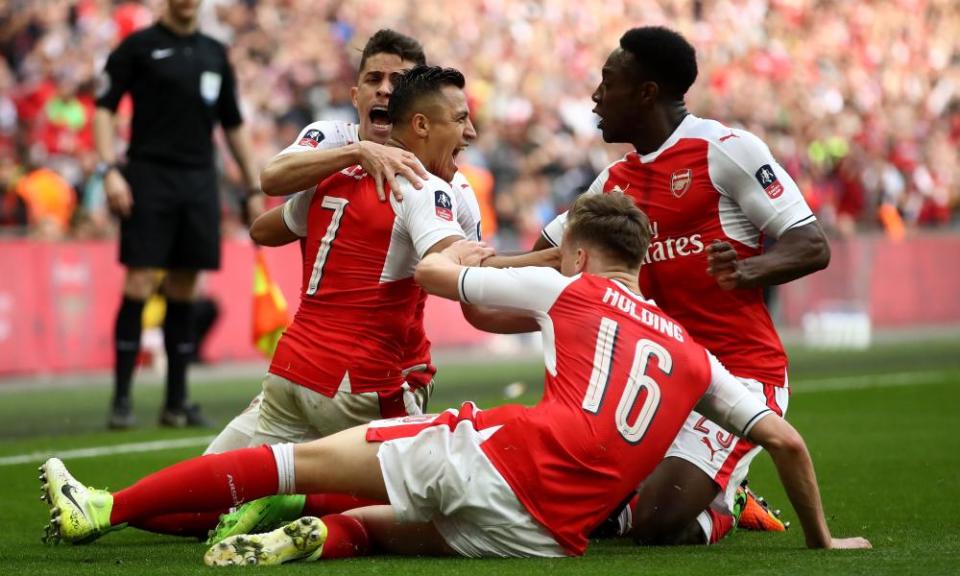 Alexis Sánchez celebrates after scoring against Manchester City in extra-time to send Arsenal through to the FA Cup final at the expense of Manchester City