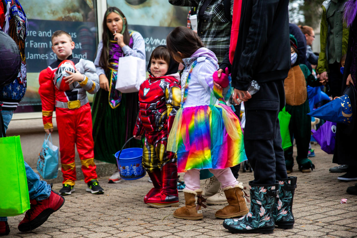 Children dress in their Halloween costumes in downtown Holland on Saturday, Oct. 30, 2021.