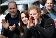 <p>Prince Harry, Prince William, Duke of Cambridge and Catherine, Duchess of Cambridge cheer on runners </p>