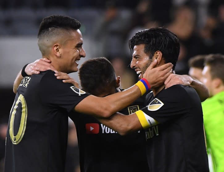 LOS ANGELES, CALIFORNIA - APRIL 13: Carlos Vela #10 of Los Angeles FC celebrates his goal, to take a 2-0 lead over FC Cincinnati, with Eduard Atuesta #20 and Diego Rossi #9 during a 2-0 win at Banc of California Stadium on April 13, 2019 in Los Angeles, California. (Photo by Harry How/Getty Images)