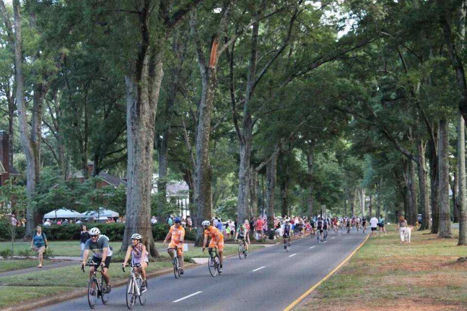 Cyclists ride through Myers Park.