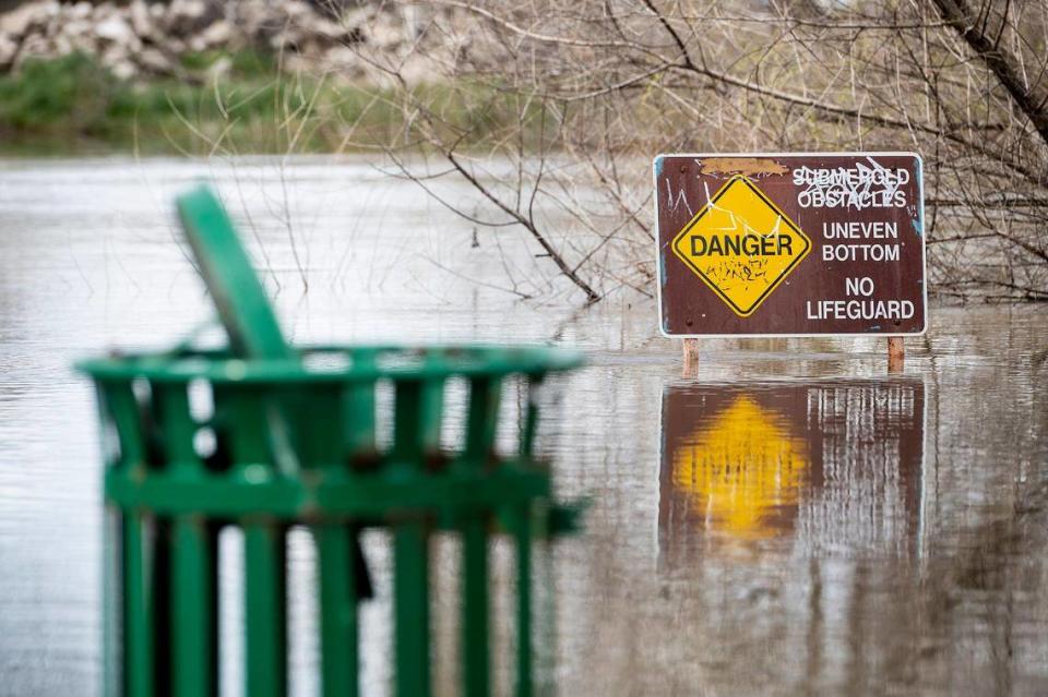 A flooded section of Hagaman Park as the Merced River remains above flood stage in Livingston, Calif., on Sunday, April 2, 2023.