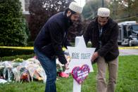 <p>Two members of the Muslim community set up a temporary grave site for one of the victims of the Tree of Life synagogue shooting in Pittsburgh, Pennsylvania. Muslim organizations <a href="https://www.cnn.com/2018/10/29/us/iyw-muslim-crowdfunding-for-synagogue-victims-trnd/index.html" rel="nofollow noopener" target="_blank" data-ylk="slk:raised over $200,000;elm:context_link;itc:0;sec:content-canvas" class="link ">raised over $200,000</a> to support families of the victims in the days following the shooting on October 27, 2018.</p>