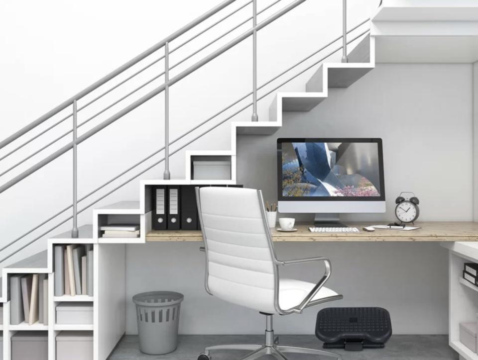 A footrest under a desk