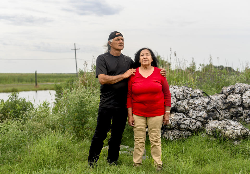 Theresa and Donald Dardar pose for a portrait in the Pointe-au-Chien community in Lafourche Parish, Louisiana., on May 19, 2019. (Photo: Emily Kask for HuffPost)