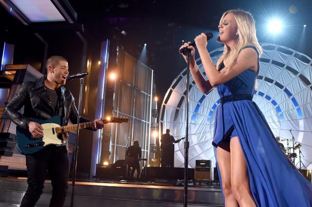 Nick Jonas and Kelsea Ballerini perform onstage during the 51st Academy of Country Music Awards at MGM Grand Garden Arena in Las Vegas on April 3, 2016.