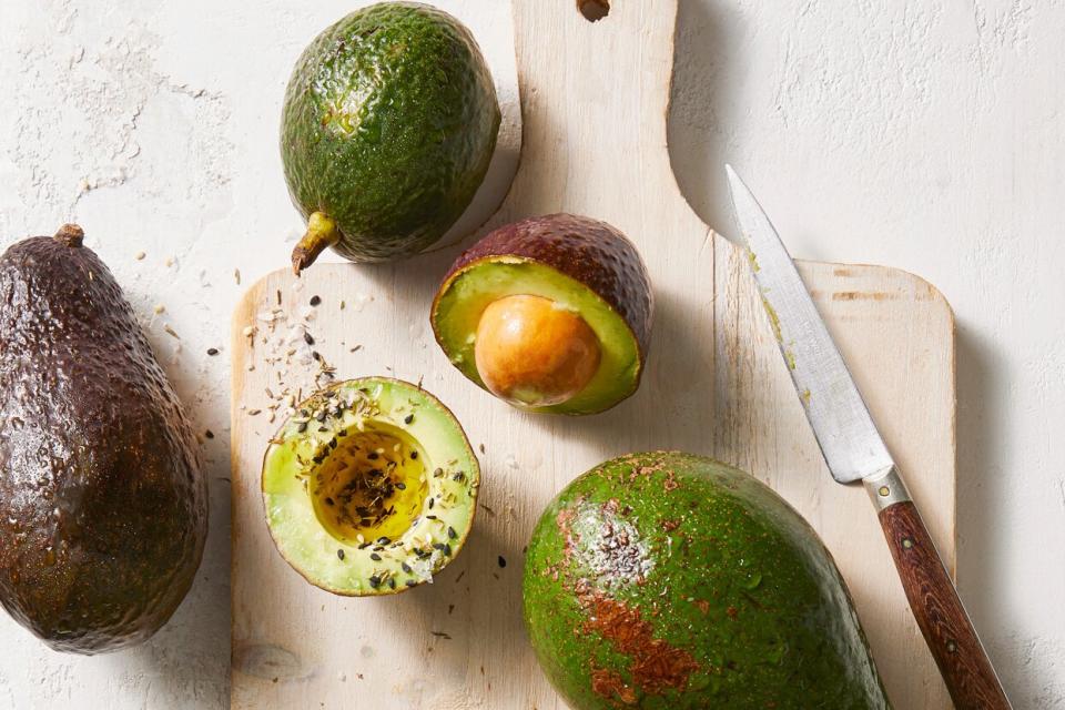 sliced avocados on cutting board