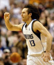 Dallas Mavericks guard Steve Nash celebrates after hitting a crucial three-point basket against the Miami Heat in the second half at the American Airlines Center in Dallas, February 15, 2003. The Mavericks defeated the Heat 98-92. REUTERS/Jeff Mitchell JM