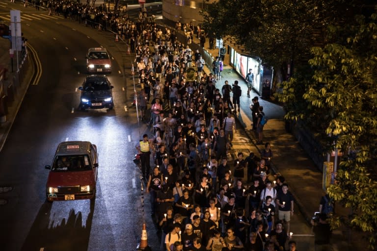 People attend a candlelight march for the late Chinese Nobel laureate Liu Xiaobo in Hong Kong on July 15, 2017