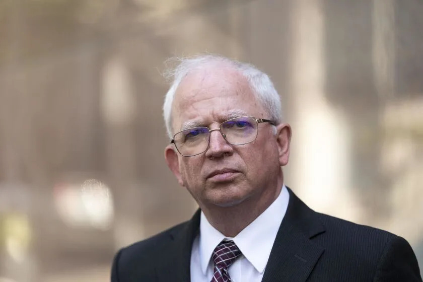 Attorney John Eastman, the architect of a legal strategy aimed at keeping former President Donald Trump in power, listens to questions from reporters after a hearing in Los Angeles, Tuesday, June 20, 2023. Eastman faces 11 disciplinary charges in the State Bar Court of California stemming from his development of a dubious legal strategy aimed at having Vice President Mike Pence interfere with the certification of President Joe Biden's victory. (AP Photo/Jae C. Hong)