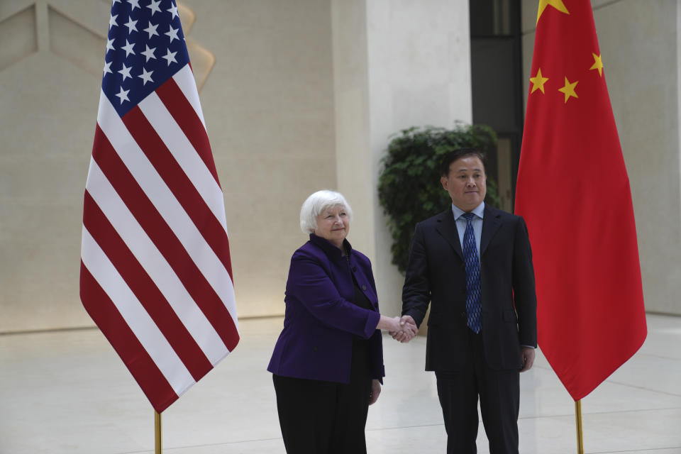 U.S. Treasury Secretary Janet Yellen, left, shakes hands with Governor of the People's Bank of China Pan Gongsheng as they meet at the People's Bank of China in Beijing Monday, April 8, 2024. (AP Photo/Tatan Syuflana, Pool)