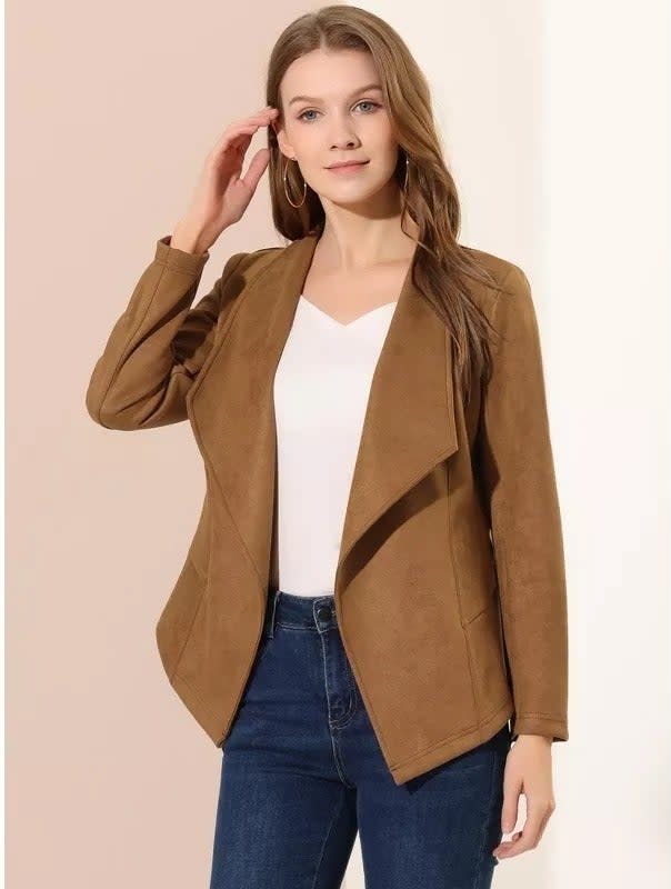 A model in a tan draped faux suede blazer