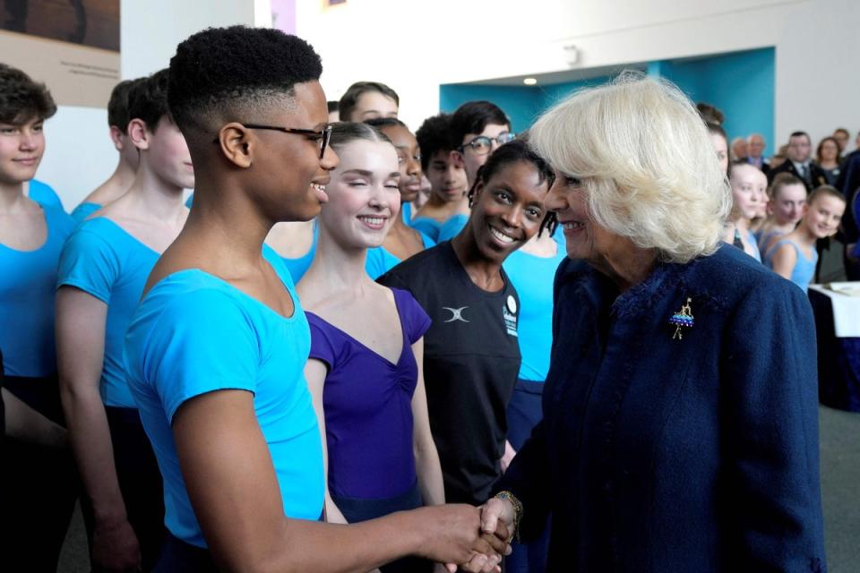 Camilla, Queen Consort (R) meets Nigerian dancer Anthony Madu, who won a scholarship after a video of him dancing in Lagos went viral, during her visit to the Elmhurst Ballet School (POOL/AFP via Getty Images)