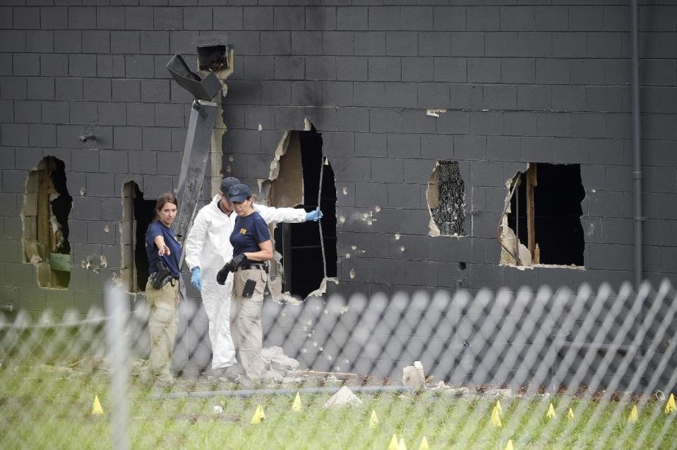 Police officials investigate the Pulse nightclub 