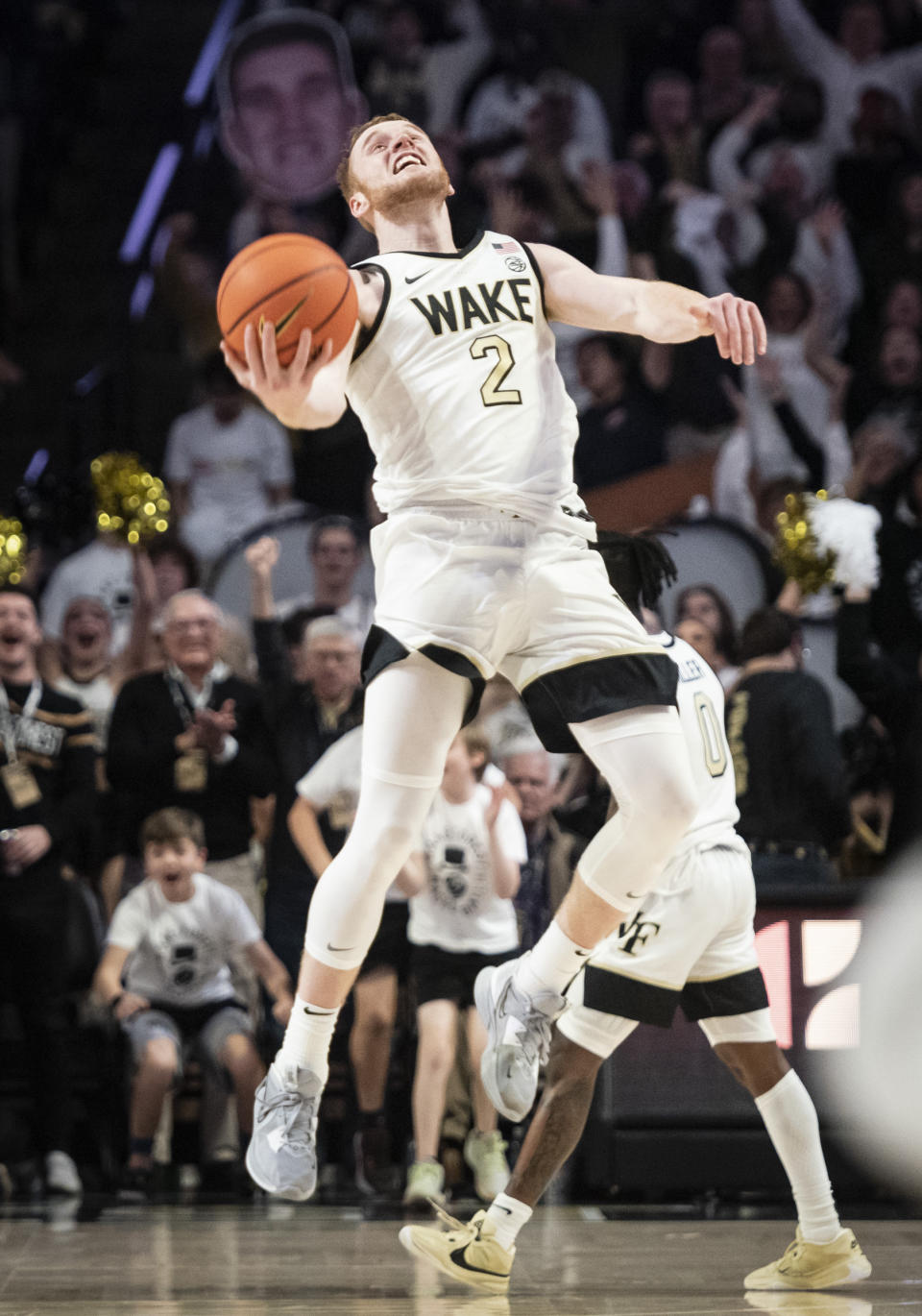 Wake Forest guard Cameron Hildreth (2) celebrates at the close of an NCAA college basketball game against Miami, Saturday, Jan. 6, 2024, in Winston-Salem, N.C. (Allison Lee Isley/The Winston-Salem Journal via AP)