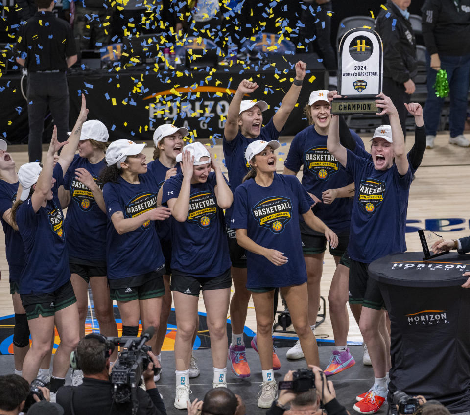Green Bay players celebrate after beating Cleveland State in the championship game of the women's NCAA college basketball Horizon League Conference Tuesday, March 12, 2024, in Indianapolis. (AP Photo/Doug McSchooler)