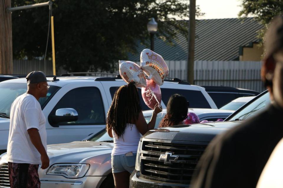 Family, friends and the community gathered outside of Tree of Life Funeral Directors in Fort Worth for a balloon release dedicated to Ivy Pierce, 4, and her 15-month-old sister Wynter Thouston, who died in a Fourth of July shooting.