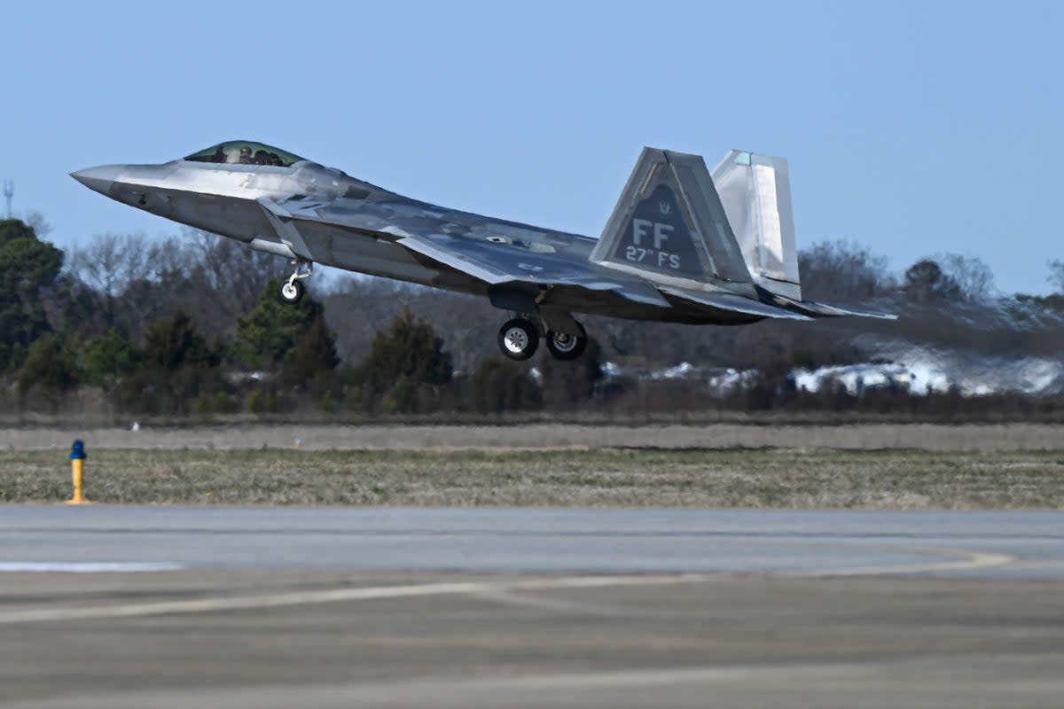 This photo provided by the U.S. Air Force shows a U.S. Air Force pilot taking off in an F-22 Raptor at Joint Base Langley-Eustis on 4 February (AP)