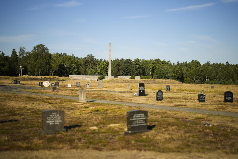 The sun lights memorial stones at the former Nazi concentration camp Bergen-Belsen in Bergen, Germany, Saturday, Sept. 3, 2022. Shaul Ladany survived a Nazi concentration camp and narrowly escaped the massacre of the Israeli athletes at the 1972 Olympic Games in Munich. Both attempts to murder him happened on German soil in the last century. Many decades later, the 86-year-year old Jew has returned to visit the two places where he narrowly escaped death. (AP Photo/Markus Schreiber)