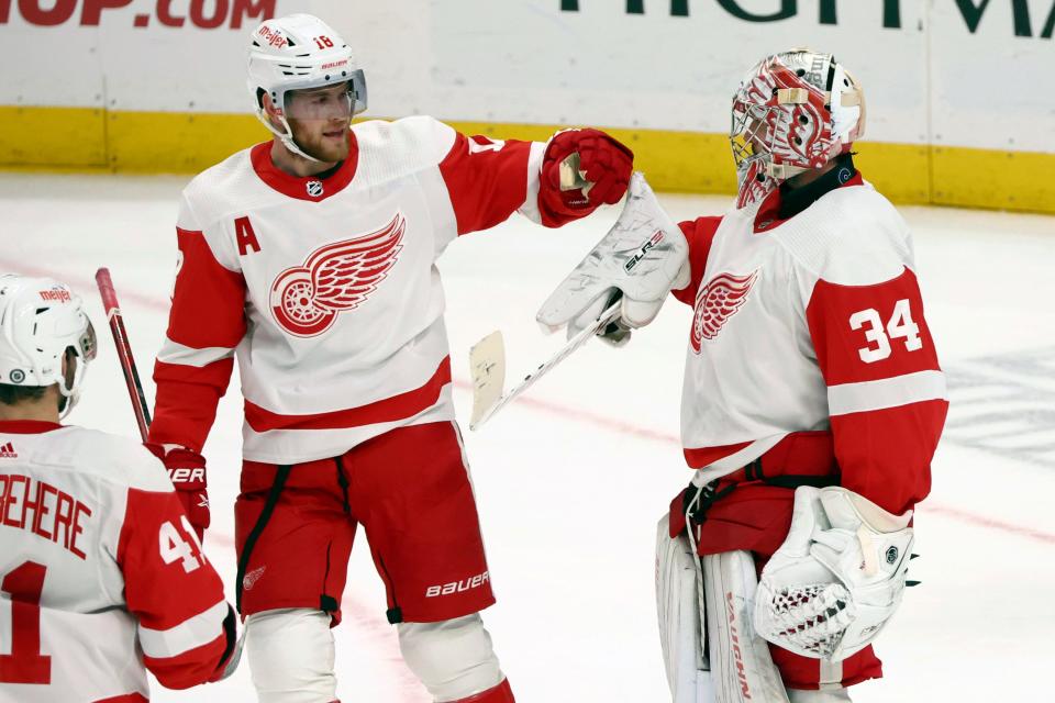 Red Wings goaltender Alex Lyon celebrates with center Andrew Copp following the third period of the Wings' 5-3 win on Tuesday, Dec. 5, 2023, in Buffalo, New York.