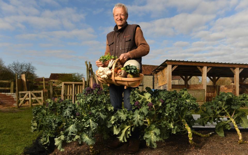 Charles Dowding with a trug full of home-grown vegetables: Dowding is a long-term advocate of no-dig gardening