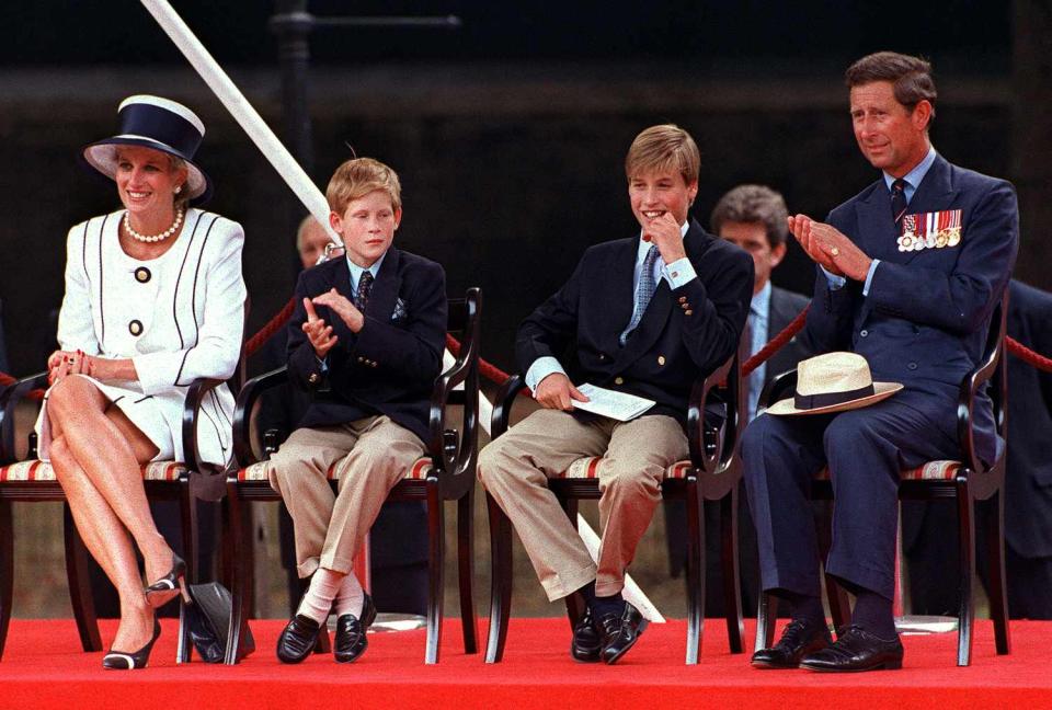 Princess Diana (1961 - 1997), Prince Harry, Prince William and Prince Charles at a parade in the Mall, London, during V.J. Day commemorations, August 1994. Diana is wearing a Tomasz Starzewski suit and a hat by Philip Somerville