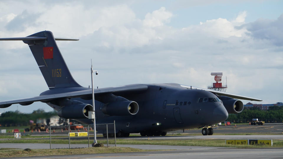 In this photo provided by the Presidential Communications Operations Office-Office of the Global Media Public Affairs, a Chinese military plane carrying the first batch of Sinovac vaccine from China arrives at the Villamor Air Base in Manila, Philippines on Sunday Feb. 28, 2021. The Philippines is due to receive its first batch of COVID-19 vaccine Sunday, among the last in Southeast Asia to secure the critical doses despite having the second-highest number of coronavirus infections and deaths in the hard-hit region. (PCOO-OGMPA via AP)