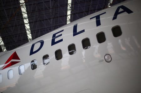 A Delta Airlines aeroplane is seen inside of a hangar during a launch event of the new alliance between AeroMexico and Delta Airlines and their announcement as sponsors of the Mexican soccer team in Mexico City