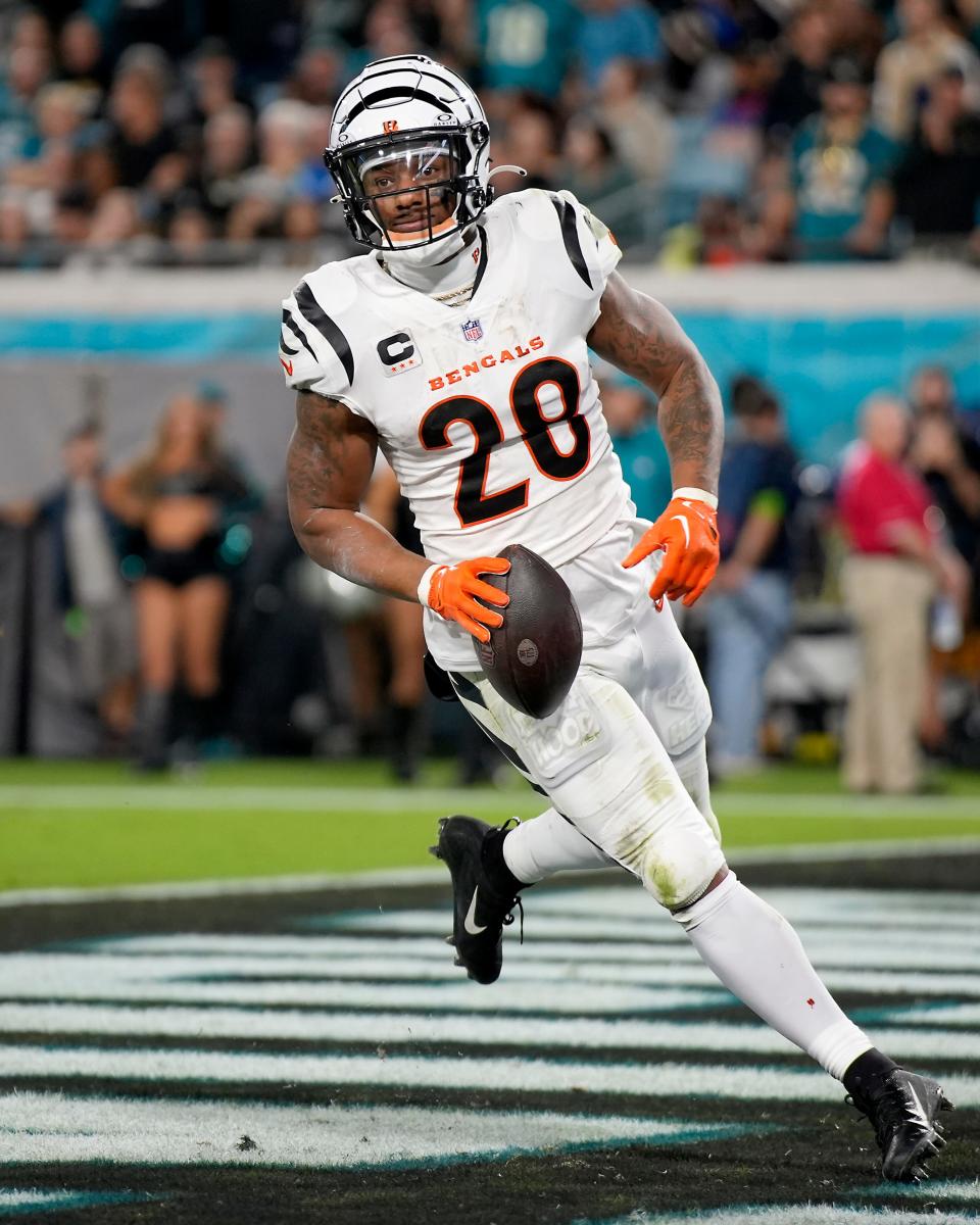 Cincinnati Bengals running back Joe Mixon (28) scores a rushing touchdown in the first half of a Week 13 NFL football game against the Jacksonville Jaguars, Monday, Dec. 4, 2023, at EverBank Stadium in Jacksonville, Fla.