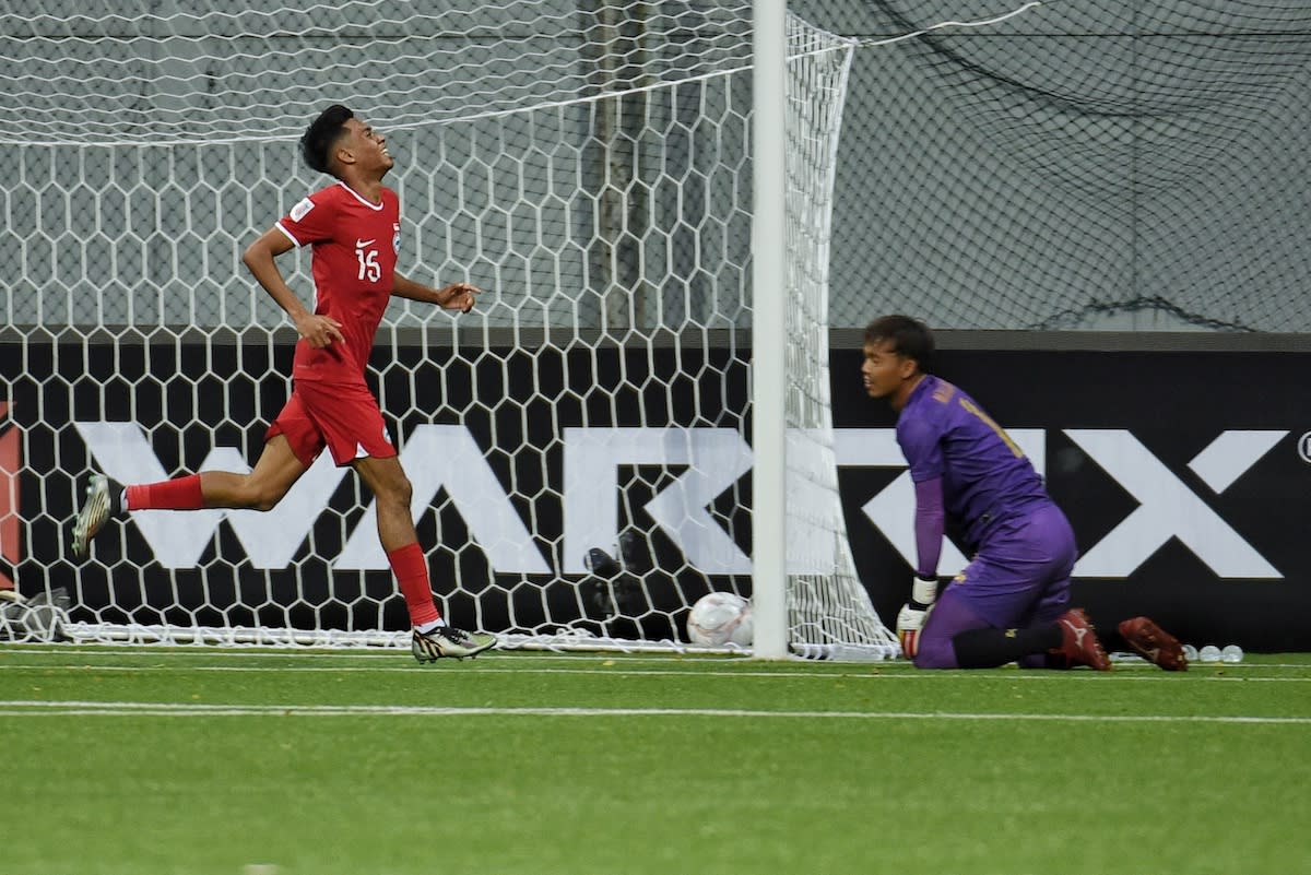 Singapore midfielder Shah Shahiran (left) runs in celebration after scoring the Lions' second goal in their 3-2 win over Myanmar in the AFF Mitsubishi Electric Cup at the Jalan Besar Stadium. (PHOTO: FAS)