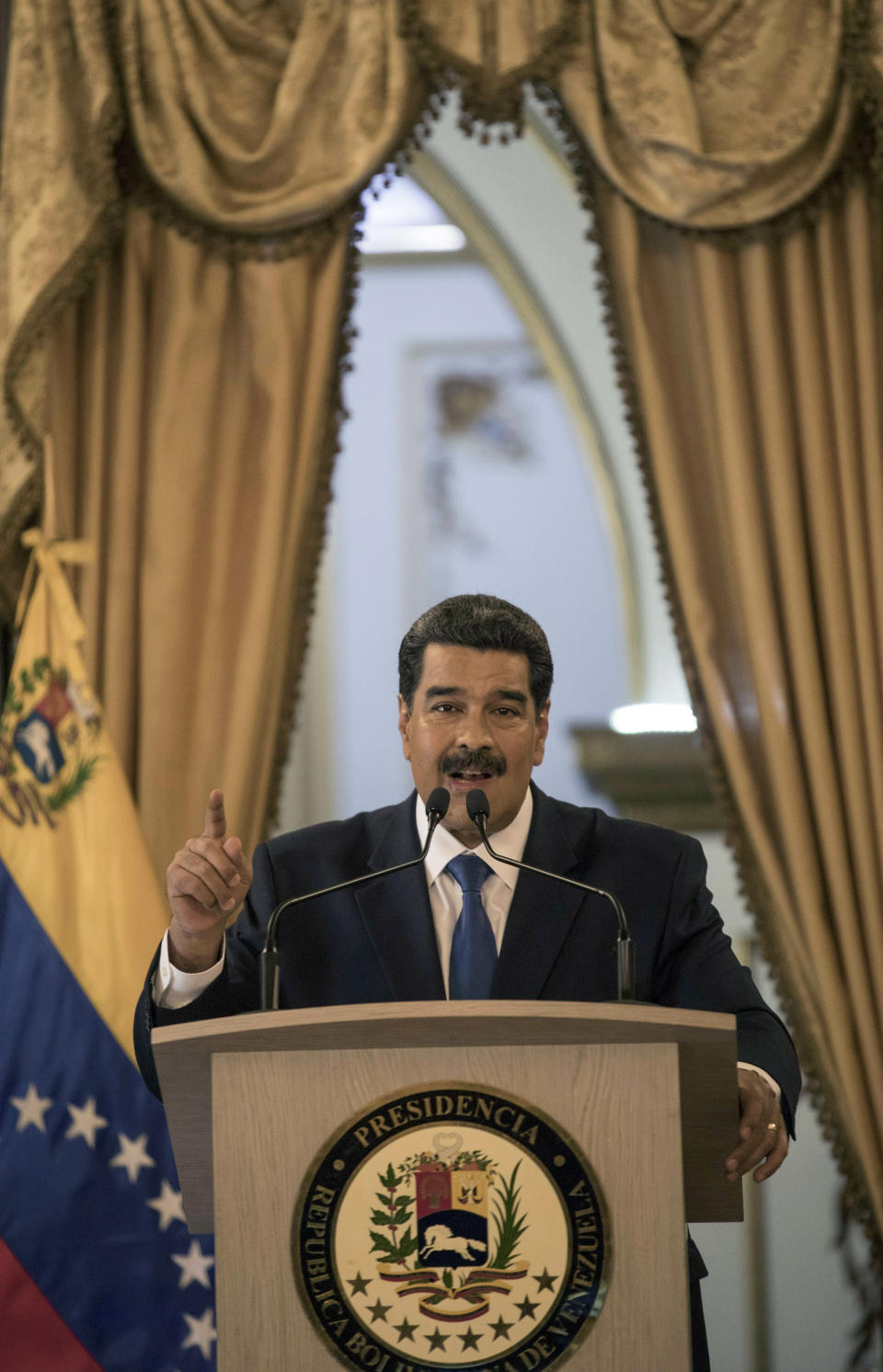 Venezuela's President Nicolas Maduro talks during a press conference at Miraflore's Presidential Palace in Caracas, Venezuela, Friday, Feb. 8, 2019. U.S. humanitarian aid destined for Venezuela was being prepared at a warehouse on the Colombian border Friday, as opposition leader Juan Guaido assured his desperate countrymen that supplies would reach them despite objections from embattled President Nicolas Maduro. (AP Photo/Rodrigo Abd)
