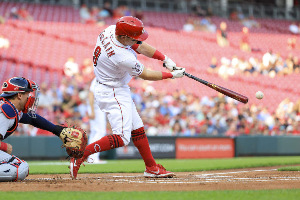 Cincinnati Reds' Matt McLain hits an RBI-double during the first inning of a baseball game against the St. Louis Cardinals in Cincinnati, Monday, May 22, 2023. AP Photo/Aaron Doster)