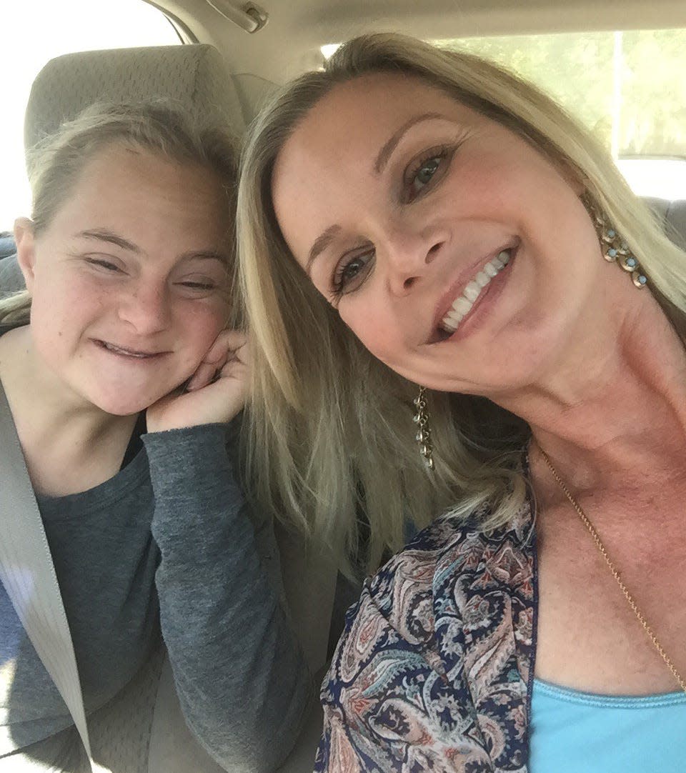 Laura Pinner, right, poses with her friend, Emma Mutz, daughter of Lakeland Mayor Bill Mutz. Pinner died Friday at age 53, more than two years after being diagnosed with ALS.