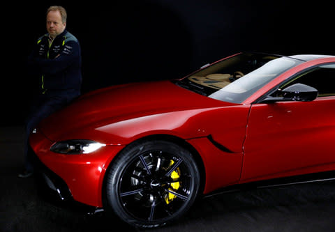 Andy Palmer, chief executive of Aston Martin, poses next to the company's new V8 Vantage  - Credit: Reuters