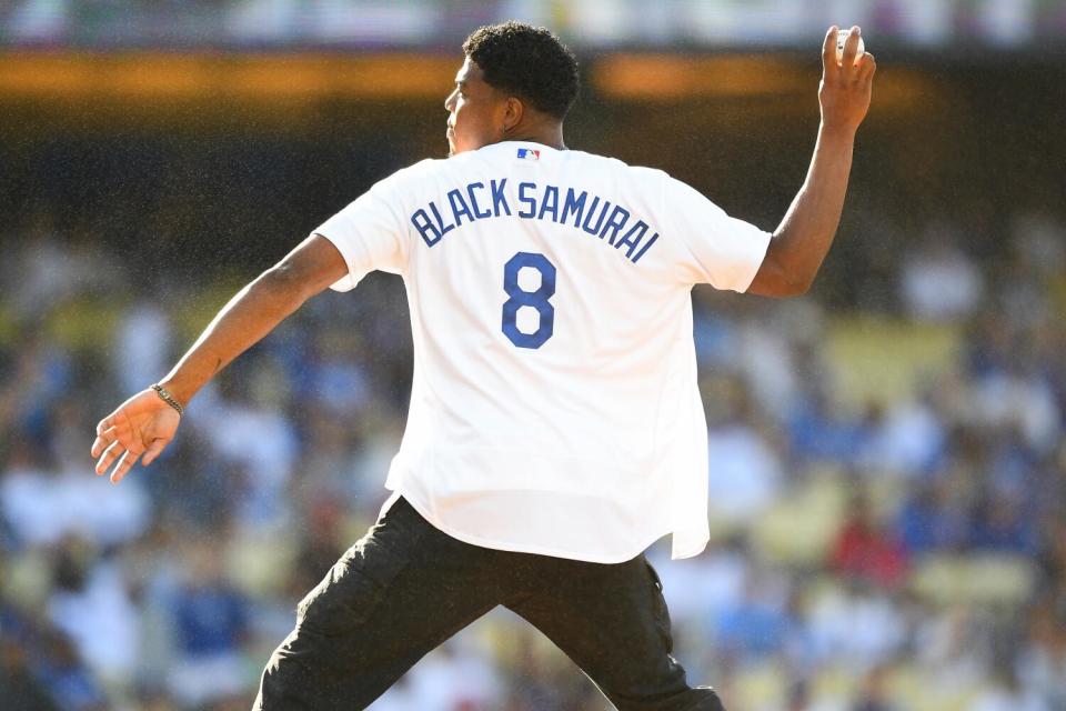 LOS ANGELES, CA - JULY 08: Los Angeles Lakers forward Rui Hachimura throws out the first pitch.