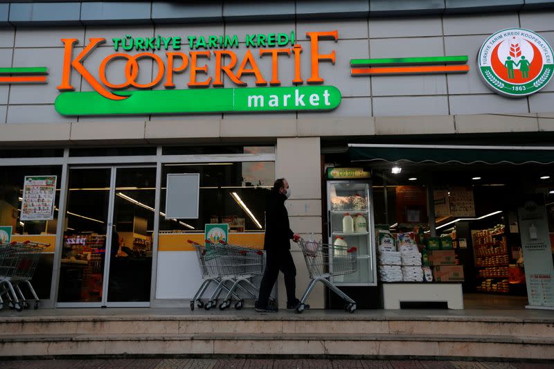 A customer enters a grocery shop of the Agricultural Credit Cooperatives of Turkey in Istanbul